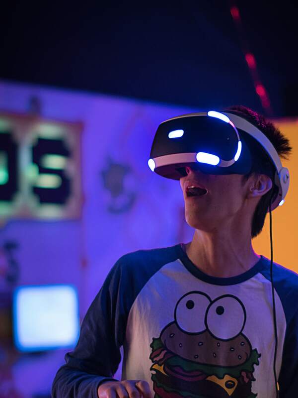 Young guy using a virtual reality headset